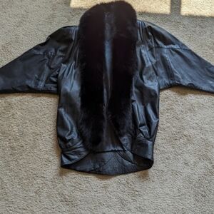 Elegant Black Leather Jacket with Fur Trim